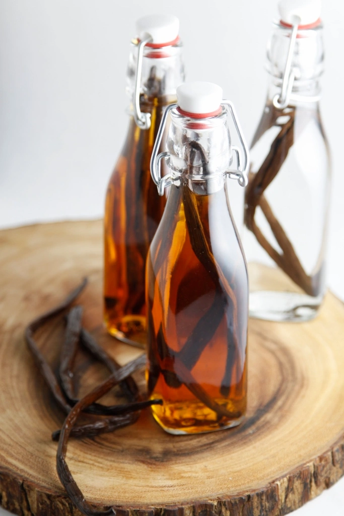 Vanilla beans soaking in alcohol during vanilla extract production